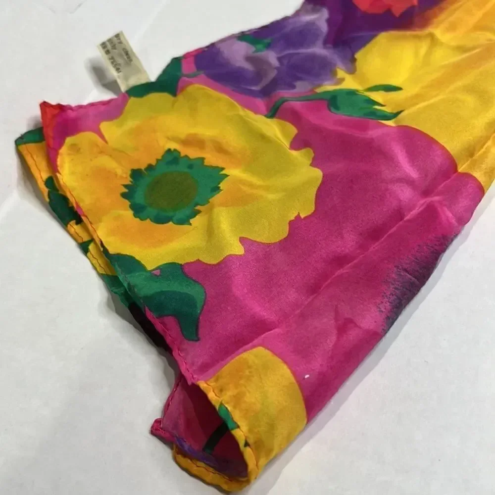 Vibrant floral silk scarf with gold purple pink and red flowers.